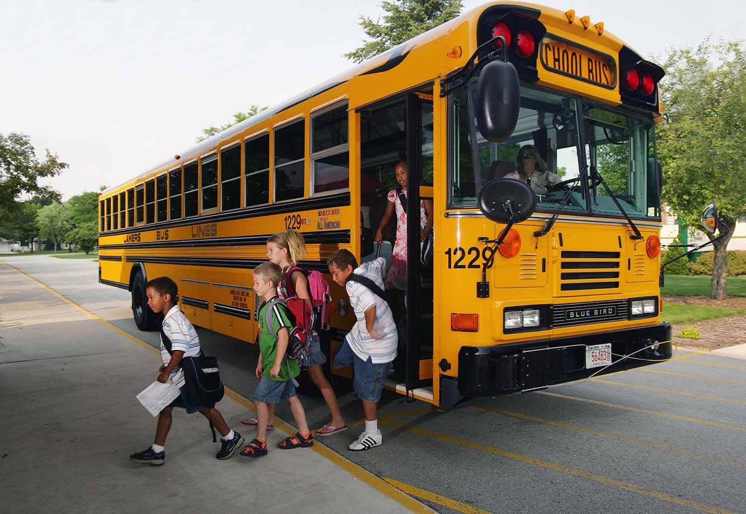 Lamers Bus Lines, Inc. school bus dropping off children
